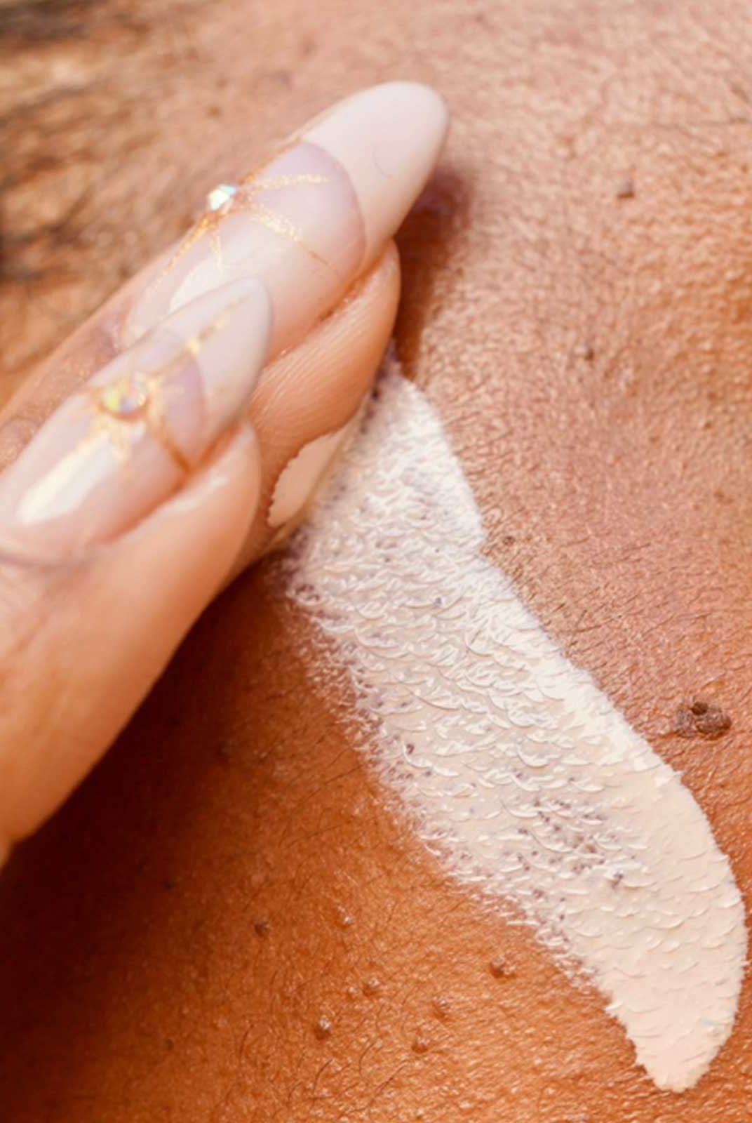A Girl Applying Cream on her Face