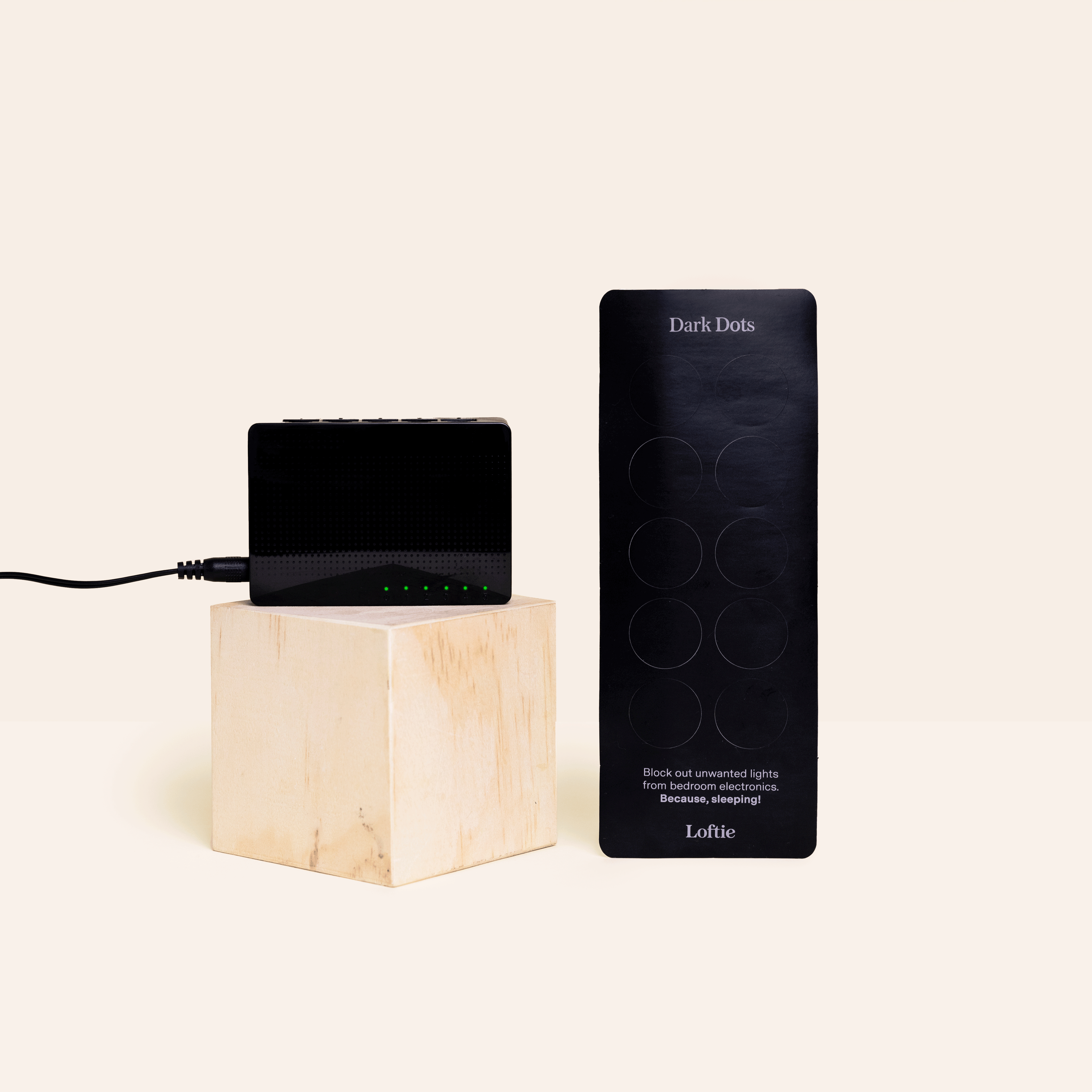 Animated demo of Loftie Dark Dots dimming a glowing device LED