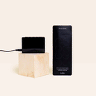 Animated demo of Loftie Dark Dots dimming a glowing device LED